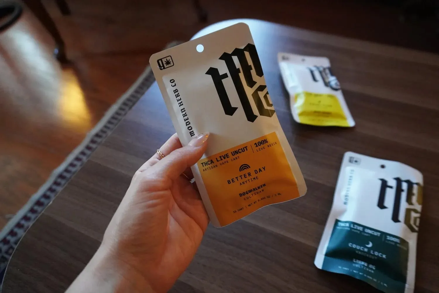 Customer holding cannabis edible packets